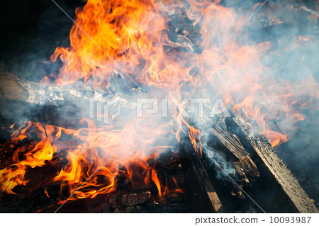 Closeup photo of big outdoor bonfire with smoke 10093987