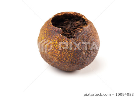 Tea Pu-erh packed in dried mandarin isolated on white 10094088