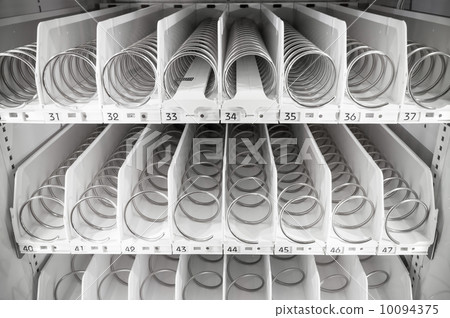 Empty white shelves of standard office vending machine Empty white shelves of standard office vending machine 10094375