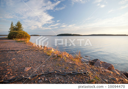 Black ships chain on the coast of Saimaa lake, Finland Black ships chain on the coast of Saimaa lake, Finland 10094470