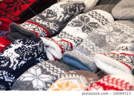 TALLINN, ESTONIA - MAY 2013: Colorful woolen mittens lie on the 10094515