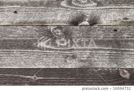Old dark brown wooden wall surface. Detailed background texture 10094732
