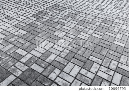Background texture of gray modern cobblestone road with wet and dry stones pattern 10094793