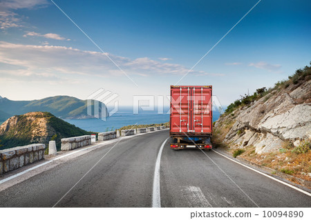 Cargo truck on the mountain highway with blue sky and sea 10094890