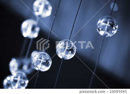Abstract dark blue background with glass spherical design elements of modern chandelier 10095045