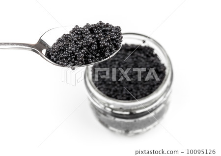 Black caviar in full glass jar and teaspoon isolated on white ba Black caviar in full glass jar and teaspoon isolated on white ba 10095126