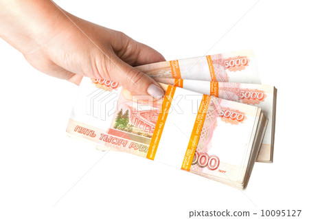 Stacks of money. Russian rubles banknotes in female hand isolated on white background Stacks of money. Russian rubles banknotes in female hand isolated on white background 10095127