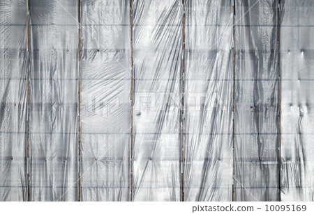 Under construction. Texture of old building facade with protection grid 10095169