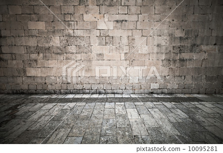 Stone wall and pavement of vintage town square 10095281