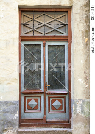 Ancient red wooden door with glass and decoration elements. Tallinn, Estonia Ancient red wooden door with glass and decoration elements. Tallinn, Estonia 10095313
