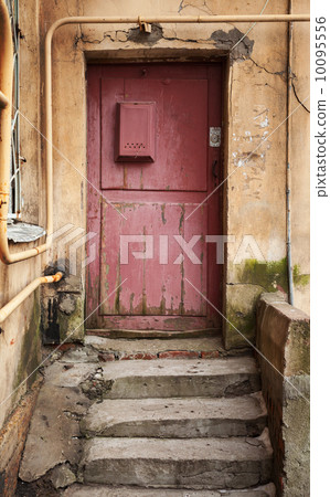 Old red wooden door with mailbox. Old part of St.Petersburg, Rus Old red wooden door with mailbox. Old part of St.Petersburg, Rus 10095556