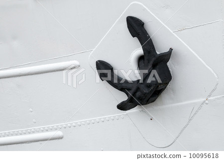 Black ships mooring anchor on white hull 10095618