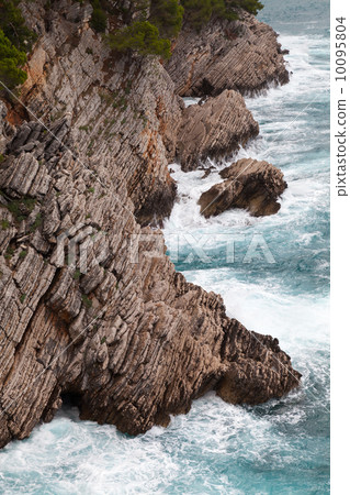 Coastal rocks with small pine trees growing on it. Adriatic Sea, Coastal rocks with small pine trees growing on it. Adriatic Sea, 10095804