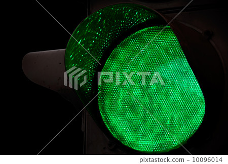Green traffic light closeup photo above black background Green traffic light closeup photo above black background 10096014