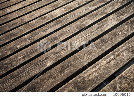 Uncolored weathered brown wooden lining boards background texture Uncolored weathered brown wooden lining boards background texture 10096015