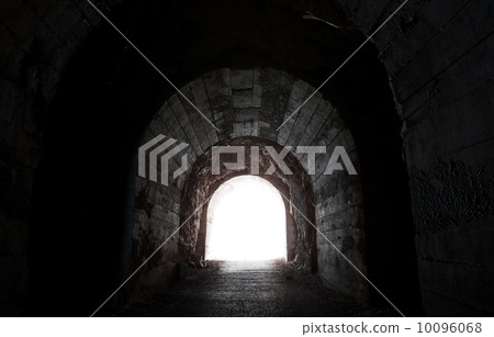 Glowing end of dark abandoned tunnel Glowing end of dark abandoned tunnel 10096068