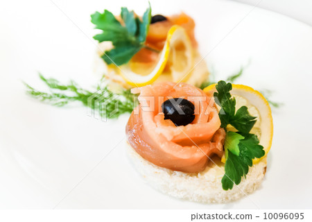 Decorated sandwiches with red fish on white plate 10096095