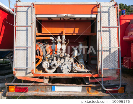 The rear of the red fire truck with water pump equipment 10096176