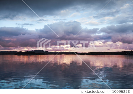 Natural photo background with dark evening Clouds over the seaco Natural photo background with dark evening Clouds over the seaco 10096238