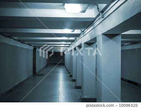 Underground passage with lights and concrete columns 10096320