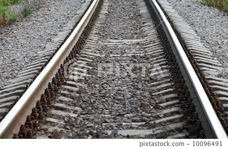 Railway perspective with gray gravel on sides Railway perspective with gray gravel on sides 10096491