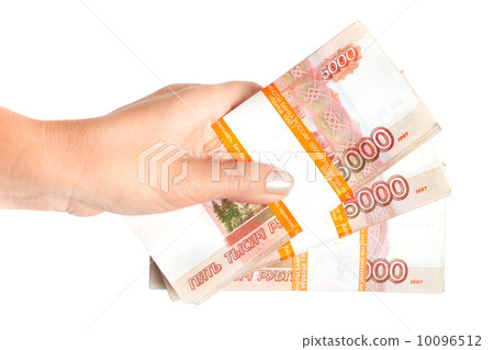 Stacks of money. Russian rubles in female hand isolated on white background 10096512