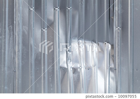 Shining damaged industrial metal wall background texture 10097055