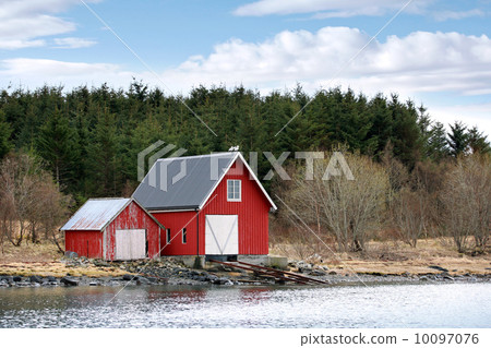 Traditional Norwegian red wooden barns on the sea coast Traditional Norwegian red wooden barns on the sea coast 10097076
