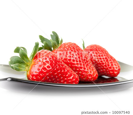 Three fresh strawberries on glass saucer isolated on white 10097540