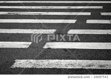 Pedestrian crossing with road marking: white rectangles on the dark asphalt road. 10097541