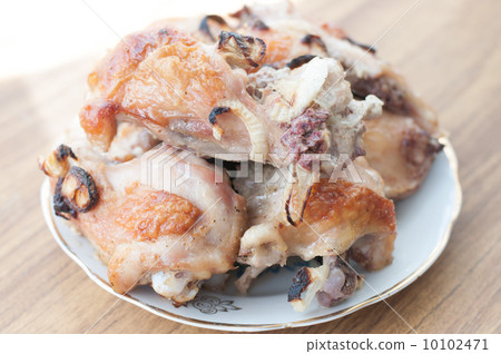 Grilled chicken legs on plate 10102471