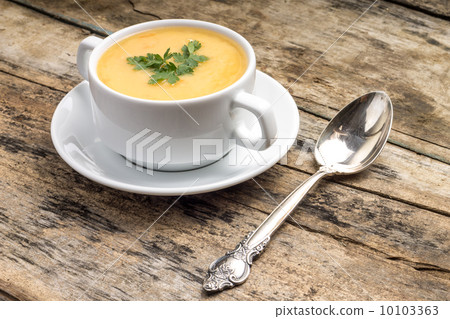 Vegetarian food. Pea soup with silver spoon 10103363