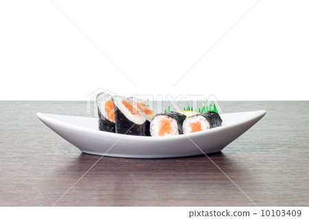 Seafood sushi in white boat plate. Maki sushi in dish with copyspace Seafood sushi in white boat plate. Maki sushi in dish with copyspace 10103409