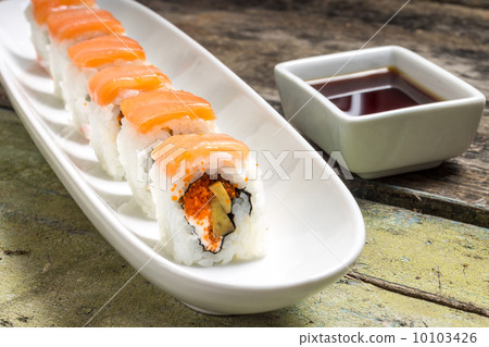 Seafood Sushi rolls in White Long Dish with soy sauce 10103426