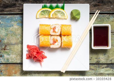 Traditional Philadelphia sushi rolls on white plate with chopstick and wasabi 10103428