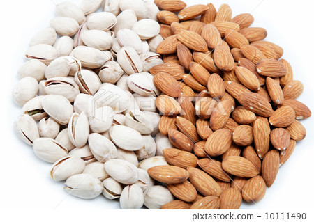 Almond and pistachio nuts isolated on white. Almond and pistachio nuts isolated on white. 10111490