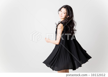 A woman in a black dress A woman in a black dress 10112012