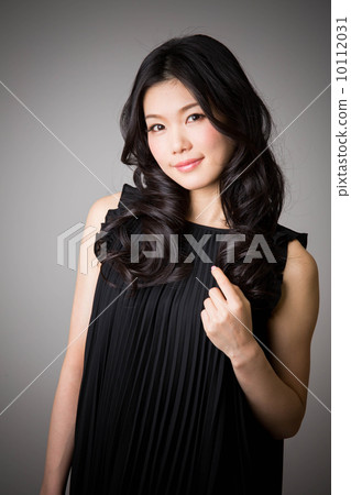 A woman in a black dress A woman in a black dress 10112031