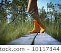 Close up of yellow rain boots and sexy legs 10117344