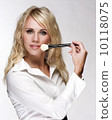 Applying make up on beautiful face 10118075