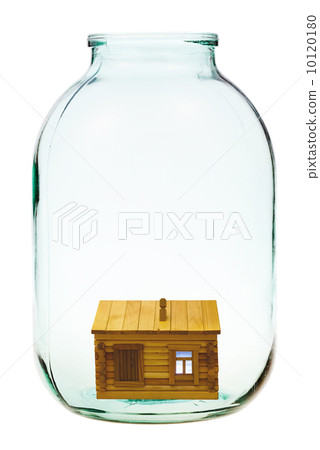 rural wooden house in big glass jar 10120180