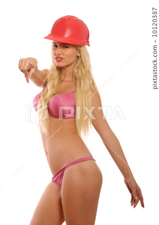 Woman in lingerie and building helmet points finger 10120387