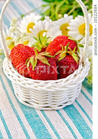 Strawberries in a basket on napkin Strawberries in a basket on napkin 10122684