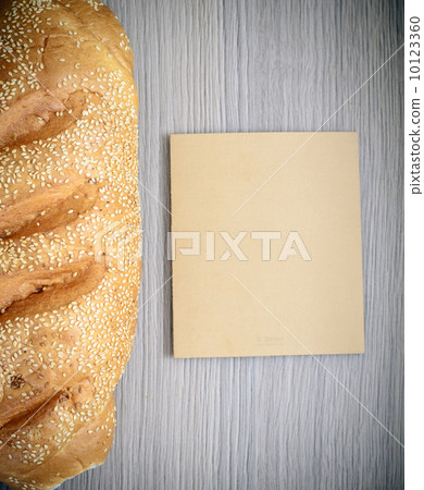 Fresh Tasty Bread on Woody Background Fresh Tasty Bread on Woody Background 10123360