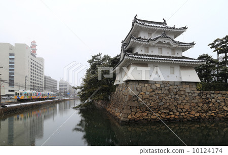 Kotoden running along Takamatsu City Tamago Park "Takamatsu Castle" Tower and Sakura Nakahori 10124174