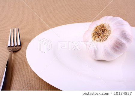 Healthy food - garlic on white plate 10124837