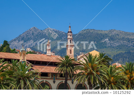 Belfry among houses and palms in Menton, France. 10125292