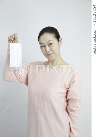 Mask and female middle age Mask and female middle age 10125554