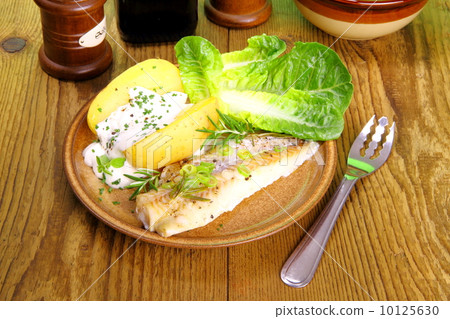Fish, potato with cottage cheese, salad and fork 10125630