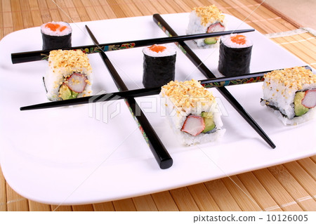 Tic tac toe play with sushi and chopsticks 10126005